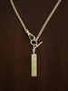 Gold curb watch chain necklace with a 'love' bar pendant