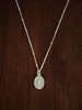 sterling Silver necklace with a flower pendant on a wooden surface