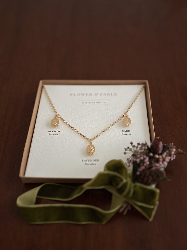 Gold Motherhood Charm Necklace with Flower & Fable posy packaging