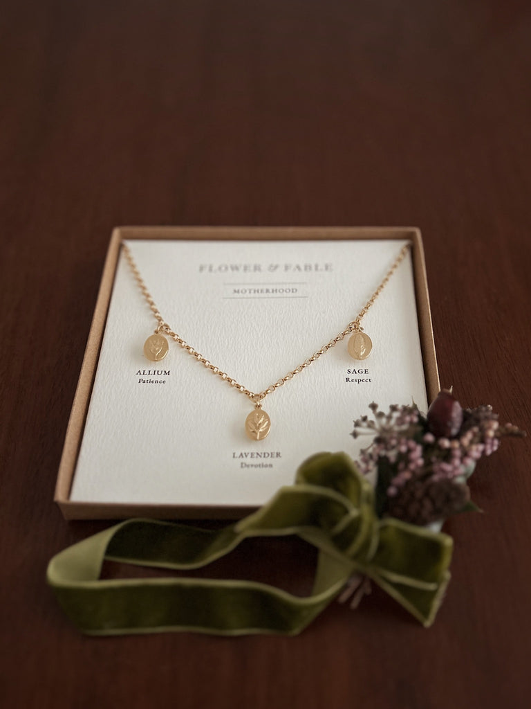 Gold Motherhood Charm Necklace with Flower & Fable posy packaging