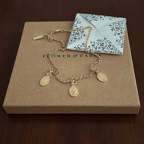 Gold Triple Charm Necklace with Flower & Fable love note