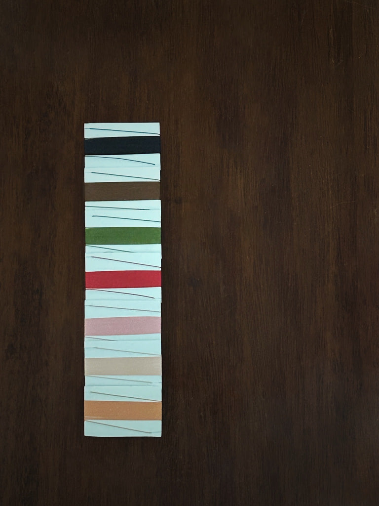 Natural thread colour choices 
on a wooden surface