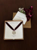Sterling Silver Coin Pendant packaged with Flower & Fable branding on a dark background